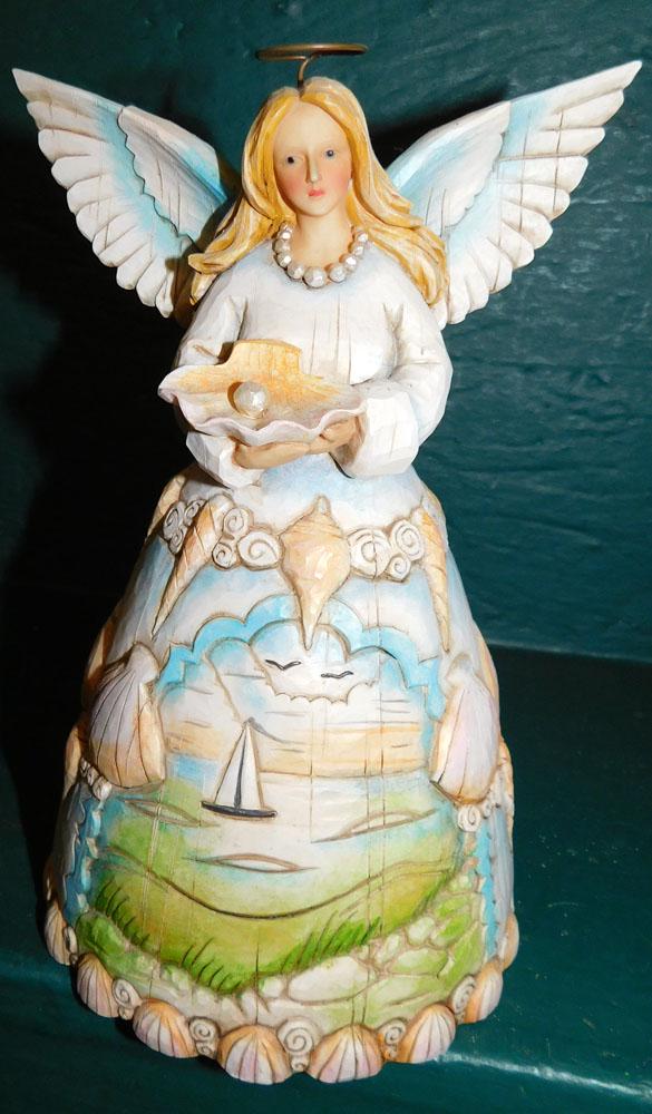Jim Shore Angel Figurine: Jim Shore Angel Figurine. 8 1/2" H ALL DESCRIPTIONS AND ANY CONDITION STATEMENT GIVEN BY LANGSTON AUCTION GALLERY ARE STRICTLY OPINIONS AND LANGSTON'S SHALL HAVE NO RESPONSIBILITY FOR ERRORS OR OMISSI