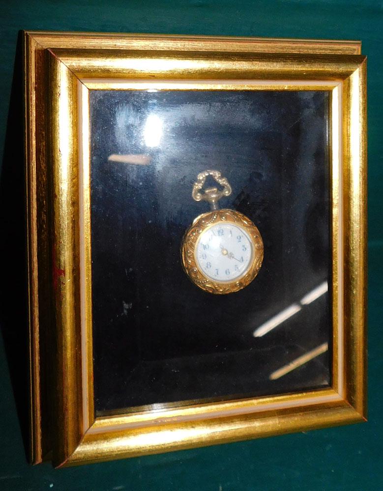 Miniature Ornate Pocket Watch in Frame: Miniature Ornate Pocket Watch in Frame . 5" x 6" ALL DESCRIPTIONS AND ANY CONDITION STATEMENT GIVEN BY LANGSTON AUCTION GALLERY ARE STRICTLY OPINIONS AND LANGSTON'S SHALL HAVE NO RESPONSIBILITY FOR ER