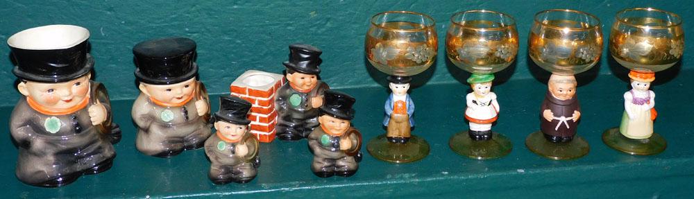 Collection of Goebel Chimney Sweep Figurines & Goebel/Hummel Figural Wine Glasses: Collection of Goebel Chimney Sweep Figurines & Goebel/Hummel Figural Wine Glasses. Up to 5 1/2" H ALL DESCRIPTIONS AND ANY CONDITION STATEMENT GIVEN BY LANGSTON AUCTION GALLERY ARE STRICTLY OPINIONS A