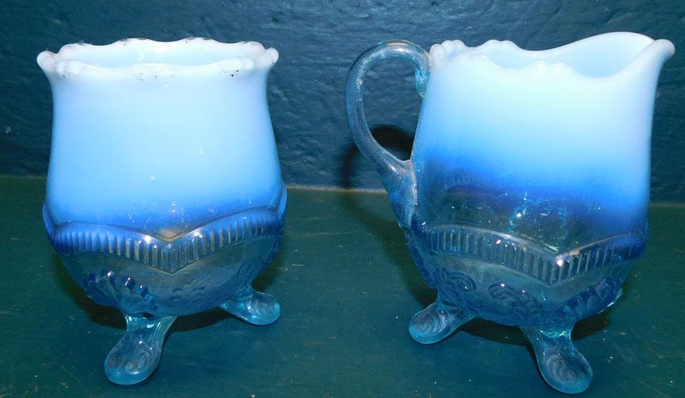 Blue Opalescent Creamer & Sugar: Blue Opalescent Creamer & Sugar . 5" H ALL DESCRIPTIONS AND ANY CONDITION STATEMENT GIVEN BY LANGSTON AUCTION GALLERY ARE STRICTLY OPINIONS AND LANGSTON'S SHALL HAVE NO RESPONSIBILITY FOR ERRORS OR OM