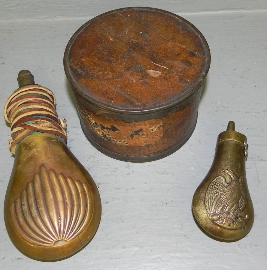 (2) brass shot pouches & (1) canister of lead shot: (2) brass shot pouches & (1) canister of lead shot.