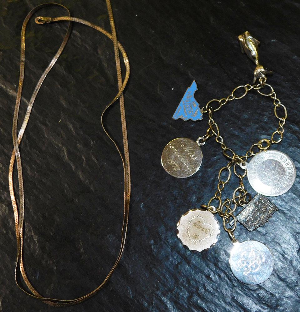 Ladies Bracelet with Sterling Charms & Marked 925 Sterling 28" Herringbone Necklace: Ladies Bracelet with Sterling Charms & Marked 925 Sterling 28" Herringbone Necklace. "ALL DESCRIPTIONS AND ANY CONDITION STATEMENT GIVEN BY LANGSTON AUCTION GALLERY ARE STRICTLY OPINIONS AND LANGSTON'