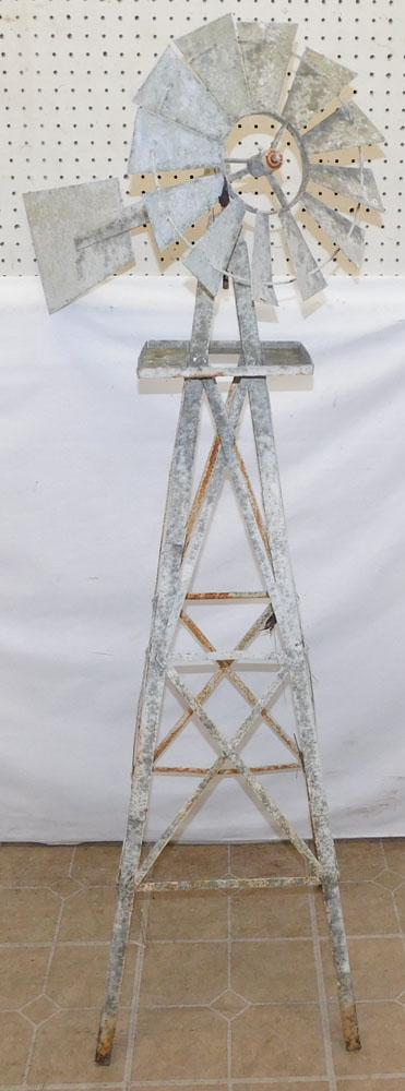 Painted Metal Wind Mill: Painted Metal Wind Mill. 56" H "ALL DESCRIPTIONS AND ANY CONDITION STATEMENT GIVEN BY LANGSTON AUCTION GALLERY ARE STRICTLY OPINIONS AND LANGSTON'S SHALL HAVE NO RESPONSIBILITY FOR ERRORS OR OMISSIONS