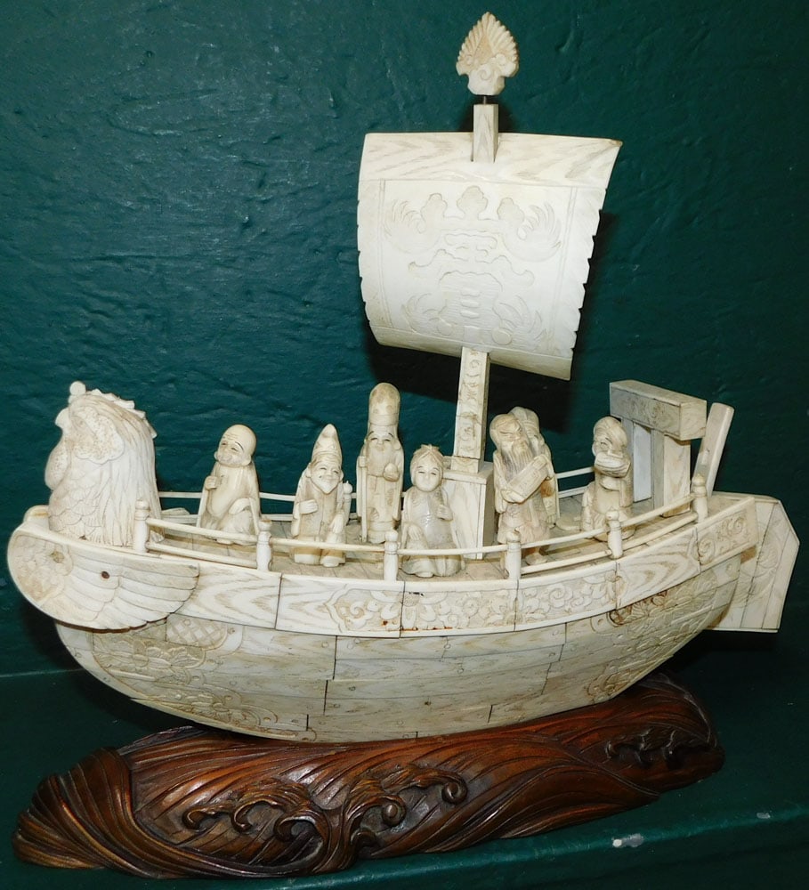 Oriental Carved Detailed Bone Ship on Carved Wood Stand: Oriental Carved Detailed Bone Ship on Carved Wood Stand . 16" L 13 1/2" H "ALL DESCRIPTIONS AND ANY CONDITION STATEMENT GIVEN BY LANGSTON AUCTION GALLERY ARE STRICTLY OPINIONS AND LANGSTON'S SHALL HAV