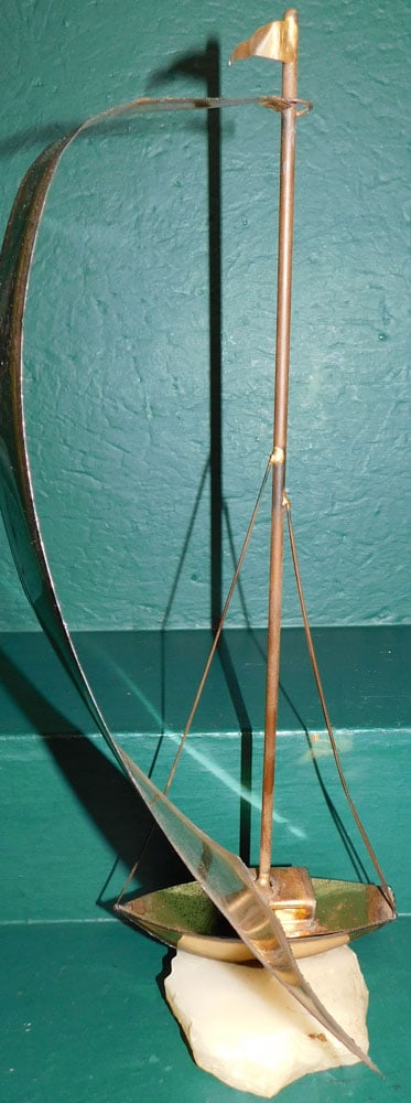 Mid Century Brass Sail Boat Sculpture on Marble Base: Mid Century Brass Sail Boat Sculpture on Marble Base . 21" H "ALL DESCRIPTIONS AND ANY CONDITION STATEMENT GIVEN BY LANGSTON AUCTION GALLERY ARE STRICTLY OPINIONS AND LANGSTON'S SHALL HAVE NO RESPONSI