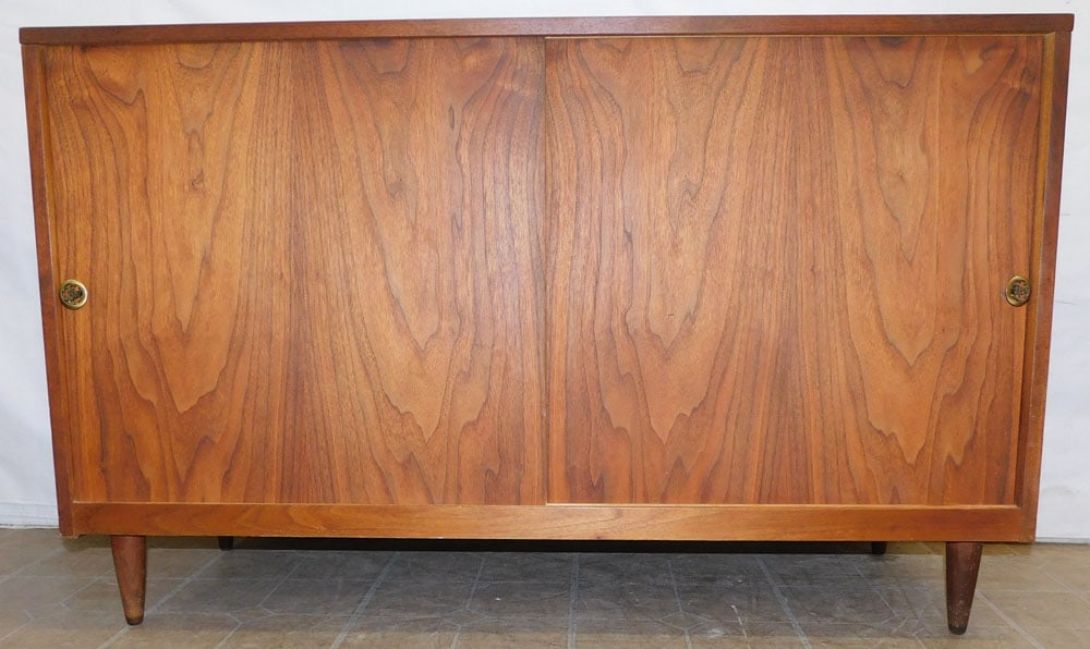 Mid Century Walnut Credenza with 2 Sliding Doors: Mid Century Walnut Credenza with 2 Sliding Doors . 50" W 60 3/4" D 31" H "ALL DESCRIPTIONS AND ANY CONDITION STATEMENT GIVEN BY LANGSTON AUCTION GALLERY ARE STRICTLY OPINIONS AND LANGSTON'S SHALL HAVE