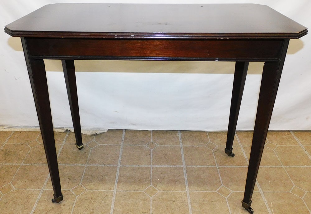 Mahogany Console: Mahogany Console. 31 1/2" W 15 3/4" D 27 1/2" H ALL DESCRIPTIONS AND ANY CONDITION STATEMENT GIVEN BY LANGSTON AUCTION GALLERY ARE STRICTLY OPINIONS AND LANGSTON'S SHALL HAVE NO RESPONSIBILITY FOR ERR