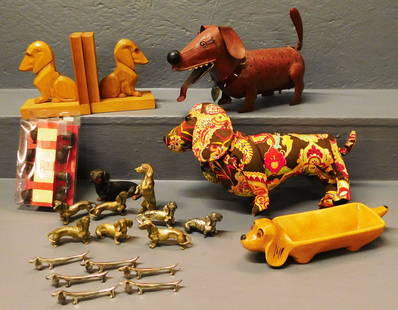 Lot of Decorative Weiner Dog Figures, (Lantern, Bookends, Etc.): Lot of Decorative Weiner Dog Figures, (Lantern, Bookends, Etc.). ALL DESCRIPTIONS AND ANY CONDITION STATEMENT GIVEN BY LANGSTON AUCTION GALLERY ARE STRICTLY OPINIONS AND LANGSTON'S SHALL HAVE NO