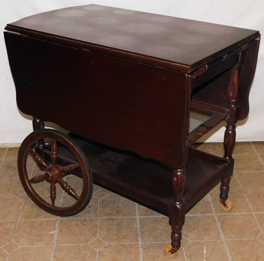 Mahogany Tea Cart: Mahogany Tea Cart . 19" W 29" D 27 1/4" H ALL DESCRIPTIONS AND ANY CONDITION STATEMENT GIVEN BY LANGSTON AUCTION GALLERY ARE STRICTLY OPINIONS AND LANGSTON'S SHALL HAVE NO RESPONSIBILITY FOR ERRORS OR