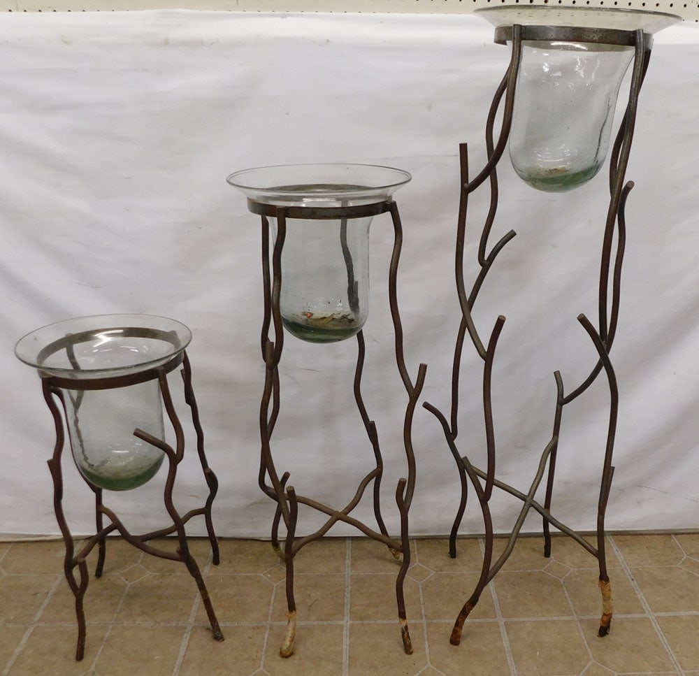 3 Graduated Wrought Iron & Glass Plant Stands: 3 Graduated Wrought Iron & Glass Plant Stands . 43" H ALL DESCRIPTIONS AND ANY CONDITION STATEMENT GIVEN BY LANGSTON AUCTION GALLERY ARE STRICTLY OPINIONS AND LANGSTON'S SHALL HAVE NO RESPONSIBILITY F