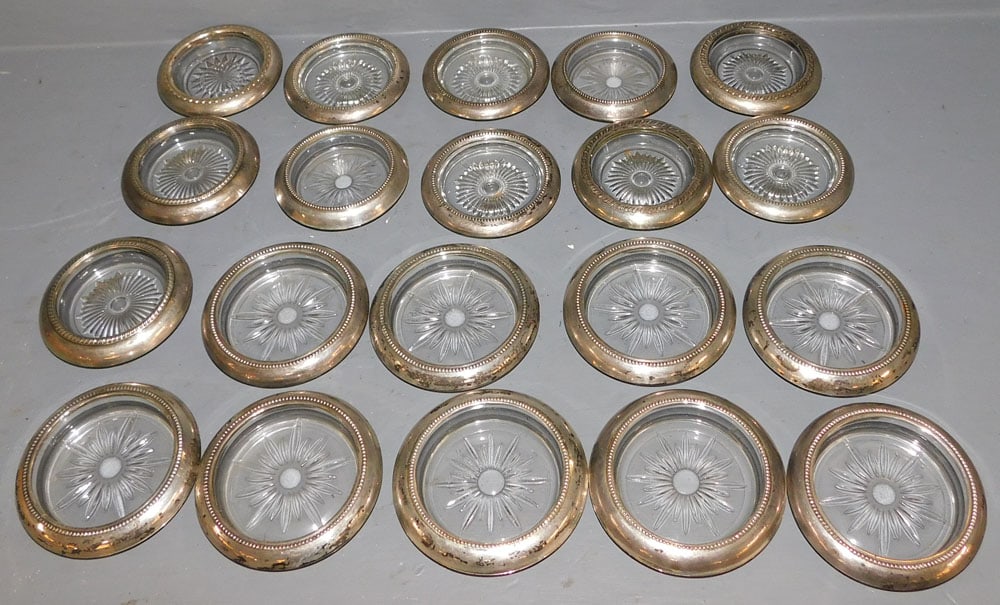 Lot 20 Sterling Rimmed Coasters: Lot 20 Sterling Rimmed Coasters. ALL DESCRIPTIONS AND ANY CONDITION STATEMENT GIVEN BY LANGSTON AUCTION GALLERY ARE STRICTLY OPINIONS AND LANGSTON'S SHALL HAVE NO RESPONSIBILITY FOR ERRORS OR OMISSION