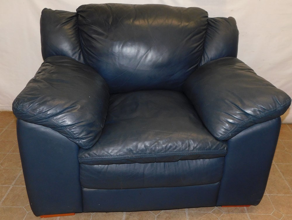 Leather Upholstered Club Chair: Leather Upholstered Club Chair. 35" H ALL DESCRIPTIONS AND ANY CONDITION STATEMENT GIVEN BY LANGSTON AUCTION GALLERY ARE STRICTLY OPINIONS AND LANGSTON'S SHALL HAVE NO RESPONSIBILITY FOR ERRORS OR OMI