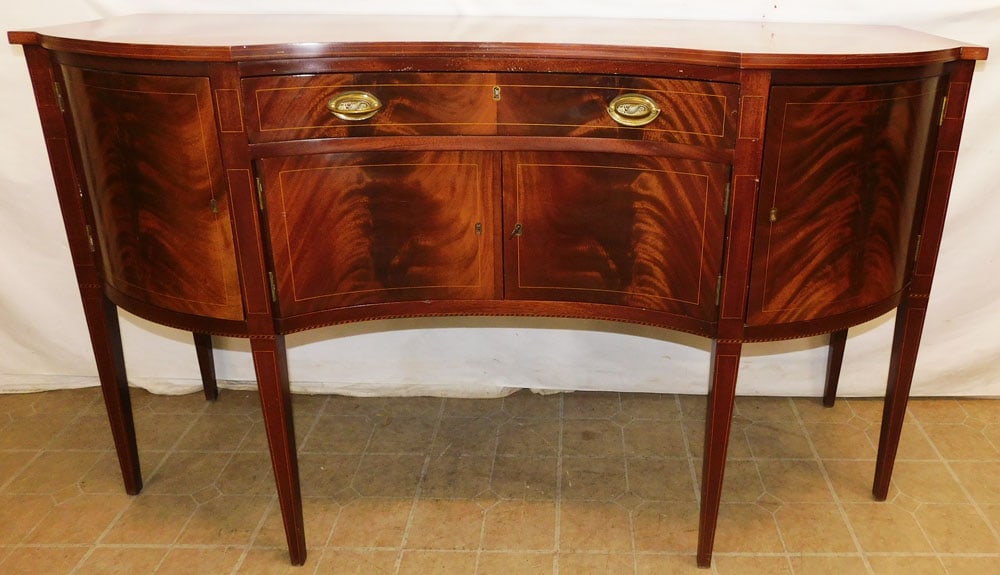 Mahogany Inlaid Serpentine Front Sideboard: Mahogany Inlaid Serpentine Front Sideboard . 66" W 24" D 38 3/4" H ALL DESCRIPTIONS AND ANY CONDITION STATEMENT GIVEN BY LANGSTON AUCTION GALLERY ARE STRICTLY OPINIONS AND LANGSTON'S SHALL HAVE NO RES