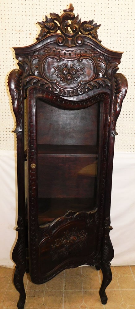 Carved Mahogany Glass Door Cabinet: Carved Mahogany Glass Door Cabinet . 27 1/4" W 17 1/2" D 79 1/2" H ALL DESCRIPTIONS AND ANY CONDITION STATEMENT GIVEN BY LANGSTON AUCTION GALLERY ARE STRICTLY OPINIONS AND LANGSTON'S SHALL HAVE NO RES