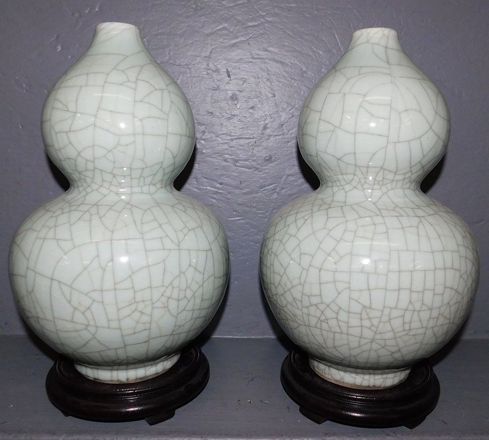 Pair of Celadon Crackleware Gourd Vases on Teakwood Stands: Pair of Celadon Crackleware Gourd Vases on Teakwood Stands. 15 1/4" H ALL DESCRIPTIONS AND ANY CONDITION STATEMENT GIVEN BY LANGSTON AUCTION GALLERY ARE STRICTLY OPINIONS AND LANGSTON'S SHALL HAVE NO