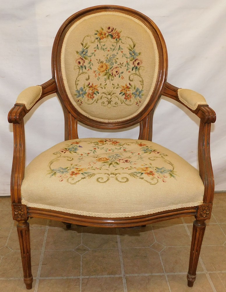 Walnut Needlepoint Upholstered French Arm Chair: Walnut Needlepoint Upholstered French Arm Chair . 35 3/4" H ALL DESCRIPTIONS AND ANY CONDITION STATEMENT GIVEN BY LANGSTON AUCTION GALLERY ARE STRICTLY OPINIONS AND LANGSTON'S SHALL HAVE NO RESPONSIBI