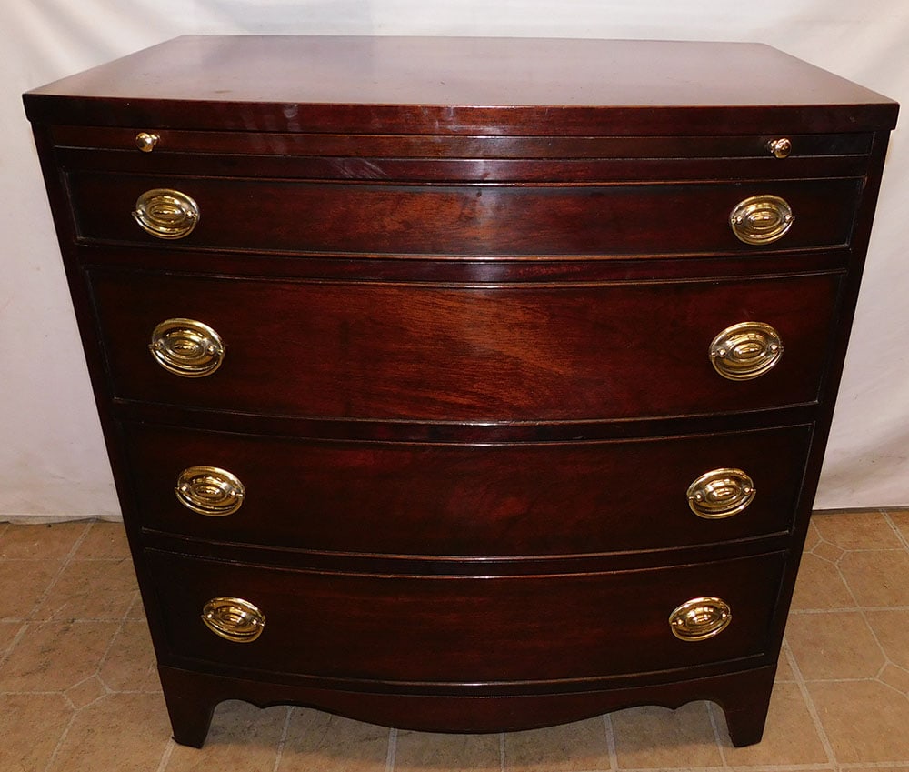 Mahogany Bow Front Four Drawer Chest By Brandt With Slides: Mahogany Bow Front Four Drawer Chest By Brandt With Slides. 32" W 20 1/2" D 34 1/4" H ALL DESCRIPTIONS AND ANY CONDITION STATEMENT GIVEN BY LANGSTON AUCTION GALLERY ARE STRICTLY OPINIONS AND LANGSTON'