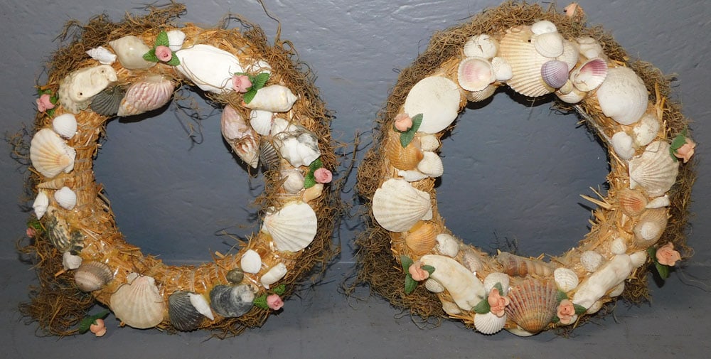 Two Seashell Wreaths: Two Seashell Wreaths. 12 1/2" Dia ALL DESCRIPTIONS AND ANY CONDITION STATEMENT GIVEN BY LANGSTON AUCTION GALLERY ARE STRICTLY OPINIONS AND LANGSTON'S SHALL HAVE NO RESPONSIBILITY FOR ERRORS OR OMISSIO