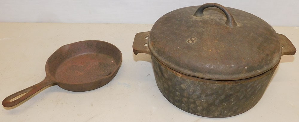 Cast Iron Pot & Skillet: Cast Iron Pot & Skillet. 6 1/2" H ALL DESCRIPTIONS AND ANY CONDITION STATEMENT GIVEN BY LANGSTON AUCTION GALLERY ARE STRICTLY OPINIONS AND LANGSTON'S SHALL HAVE NO RESPONSIBILITY FOR ERRORS OR OMISSIO