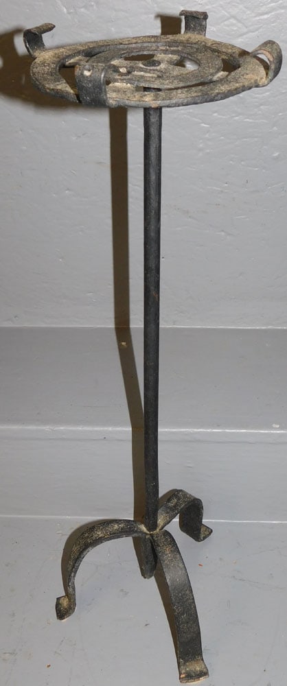 Cast Iron Trivet Stand: Cast Iron Trivet Stand. 24 1/2" H ALL DESCRIPTIONS AND ANY CONDITION STATEMENT GIVEN BY LANGSTON AUCTION GALLERY ARE STRICTLY OPINIONS AND LANGSTON'S SHALL HAVE NO RESPONSIBILITY FOR ERRORS OR OMISSIO