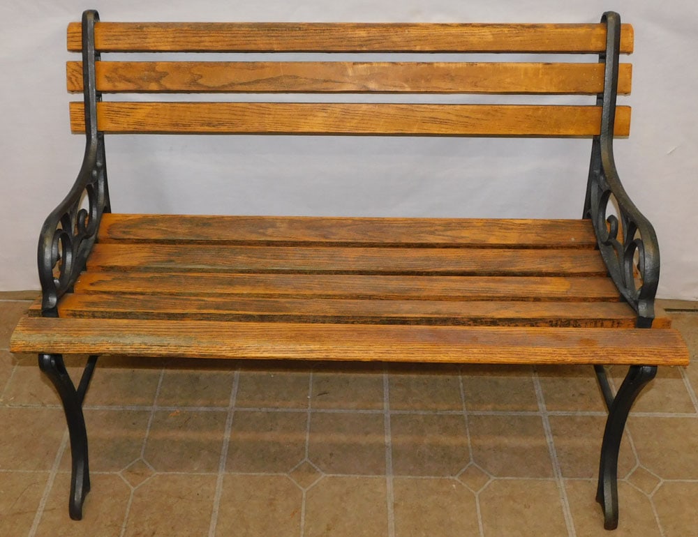 Oak & Cast Iron Bench: Oak & Cast Iron Bench . 39 1/2" W 21" D 27 3/4" H ALL DESCRIPTIONS AND ANY CONDITION STATEMENT GIVEN BY LANGSTON AUCTION GALLERY ARE STRICTLY OPINIONS AND LANGSTON'S SHALL HAVE NO RESPONSIBILITY FOR E