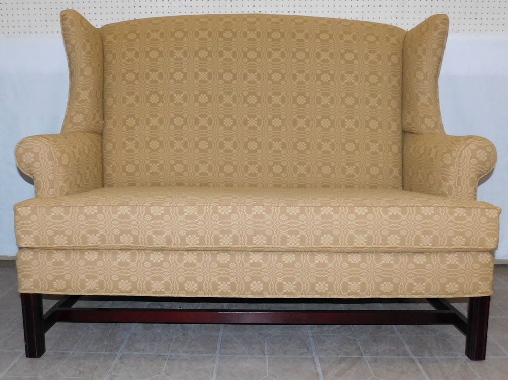 Upholstered Wing Back Settee By Lancer Corp.: Upholstered Wing Back Settee By Lancer Corp.. 60" W 44 1/2" H ALL DESCRIPTIONS AND ANY CONDITION STATEMENT GIVEN BY LANGSTON AUCTION GALLERY ARE STRICTLY OPINIONS AND LANGSTON'S SHALL HAVE NO RESPONSI