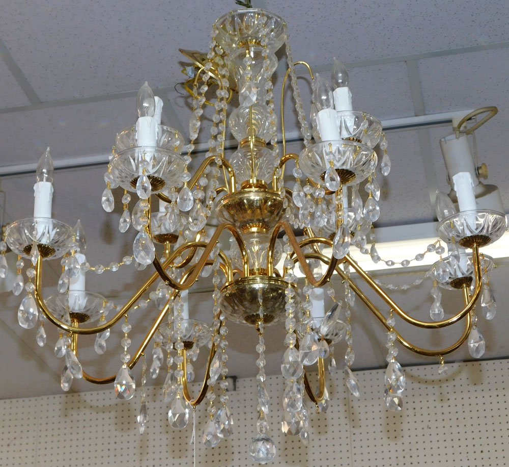 Crystal & Gilt Metal 12 Light Chandelier: Crystal & Gilt Metal 12 Light Chandelier. 28" H ALL DESCRIPTIONS AND ANY CONDITION STATEMENT GIVEN BY LANGSTON AUCTION GALLERY ARE STRICTLY OPINIONS AND LANGSTON'S SHALL HAVE NO RESPONSIBILITY FOR ERR
