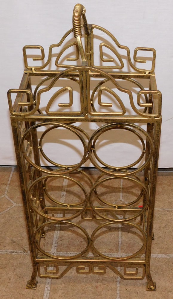 Gilt Paint Decorated Wine Rack: Gilt Paint Decorated Wine Rack. 22 1/2" H ALL DESCRIPTIONS AND ANY CONDITION STATEMENT GIVEN BY LANGSTON AUCTION GALLERY ARE STRICTLY OPINIONS AND LANGSTON'S SHALL HAVE NO RESPONSIBILITY FOR ERRORS OR