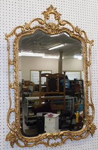 Ornate Gilt Framed Beveled Mirror: Ornate Gilt Framed Beveled Mirror. 33" x 48 1/2" ALL DESCRIPTIONS AND ANY CONDITION STATEMENT GIVEN BY LANGSTON AUCTION GALLERY ARE STRICTLY OPINIONS AND LANGSTON'S SHALL HAVE NO RESPONSIBILITY FOR ER