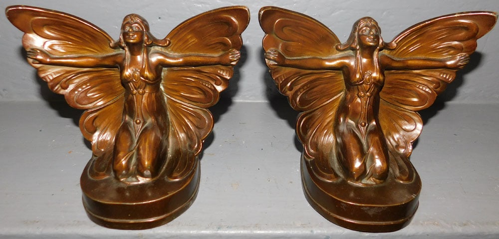 Pair Painted Metal Female Butterfly Bookends: Pair Painted Metal Female Butterfly Bookends. 6 1/4" H ALL DESCRIPTIONS AND ANY CONDITION STATEMENT GIVEN BY LANGSTON AUCTION GALLERY ARE STRICTLY OPINIONS AND LANGSTON'S SHALL HAVE NO RESPONSIBILITY