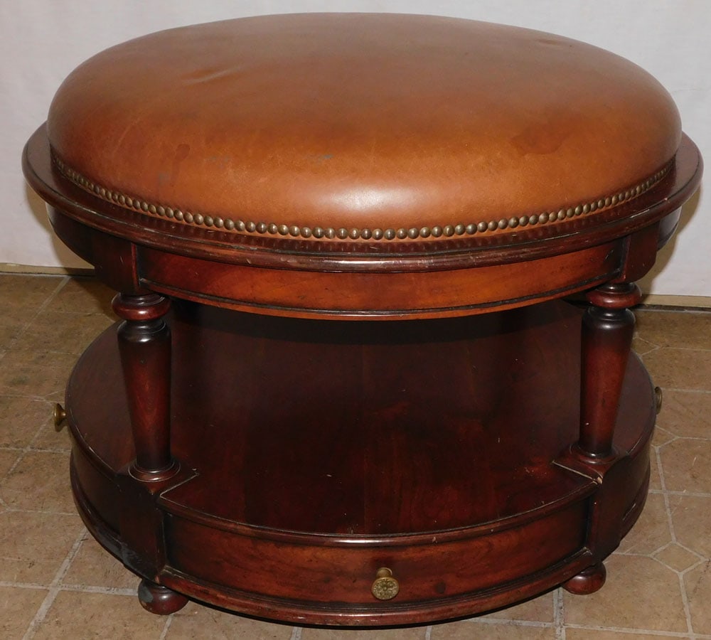 Mahogany Two Drawer Leather Top Ottoman: Mahogany Two Drawer Leather Top Ottoman. 31" Dia. 23" H ALL DESCRIPTIONS AND ANY CONDITION STATEMENT GIVEN BY LANGSTON AUCTION GALLERY ARE STRICTLY OPINIONS AND LANGSTON'S SHALL HAVE NO RESPONSIBILITY