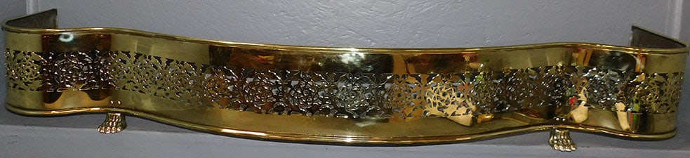 Polished Open Work Serpentine Fire Place Fender With Paw Feet: Polished Open Work Serpentine Fire Place Fender With Paw Feet. 53 3/4" W 8" H ALL DESCRIPTIONS AND ANY CONDITION STATEMENT GIVEN BY LANGSTON AUCTION GALLERY ARE STRICTLY OPINIONS AND LANGSTON'S SHALL 