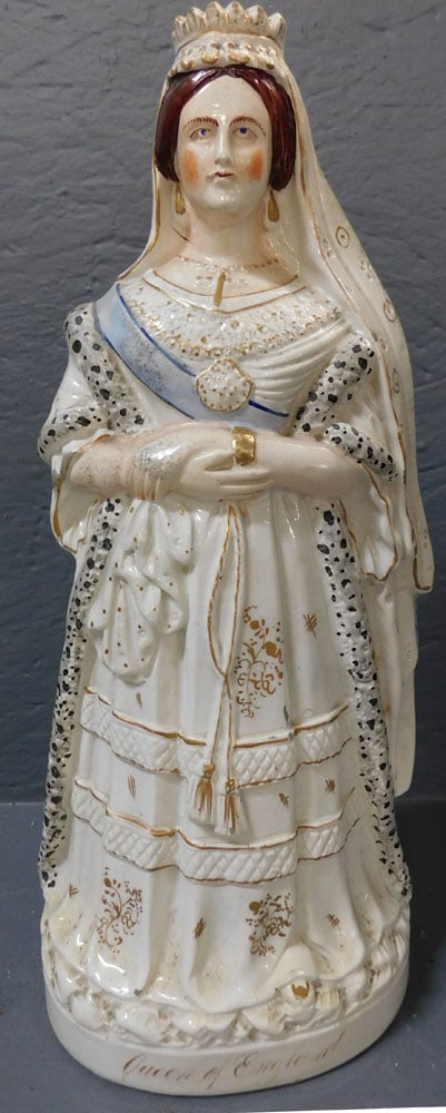 Queen Of England Staffordshire Figure: Queen Of England Staffordshire Figure. 17 3/4" H ALL DESCRIPTIONS AND ANY CONDITION STATEMENT GIVEN BY LANGSTON AUCTION GALLERY ARE STRICTLY OPINIONS AND LANGSTON'S SHALL HAVE NO RESPONSIBILITY FOR ER