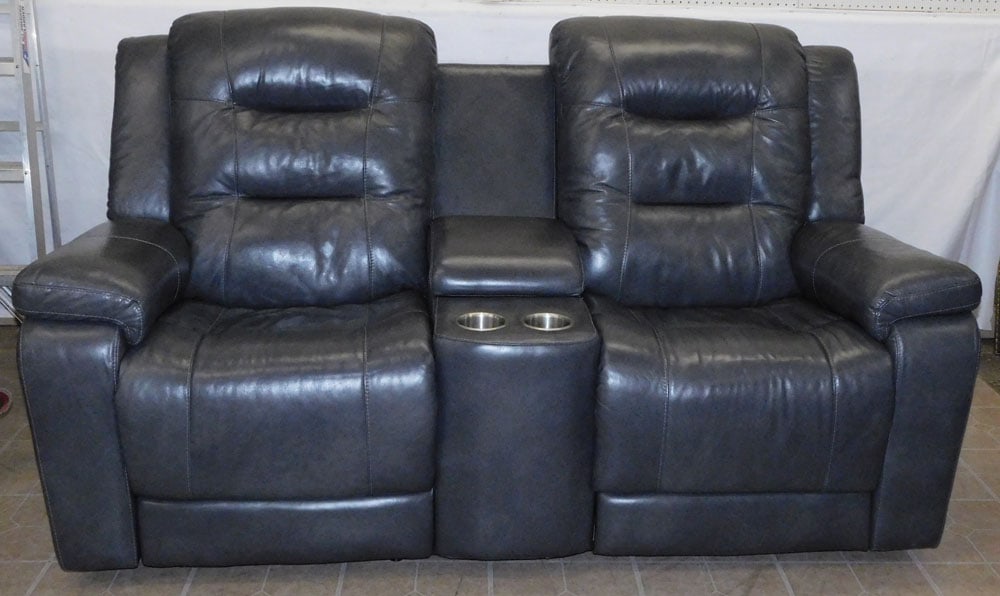 Electric Reclining Leather Love Seat: Electric Reclining Leather Love Seat. 74" W 42" H ALL DESCRIPTIONS AND ANY CONDITION STATEMENT GIVEN BY LANGSTON AUCTION GALLERY ARE STRICTLY OPINIONS AND LANGSTON'S SHALL HAVE NO RESPONSIBILITY FOR E