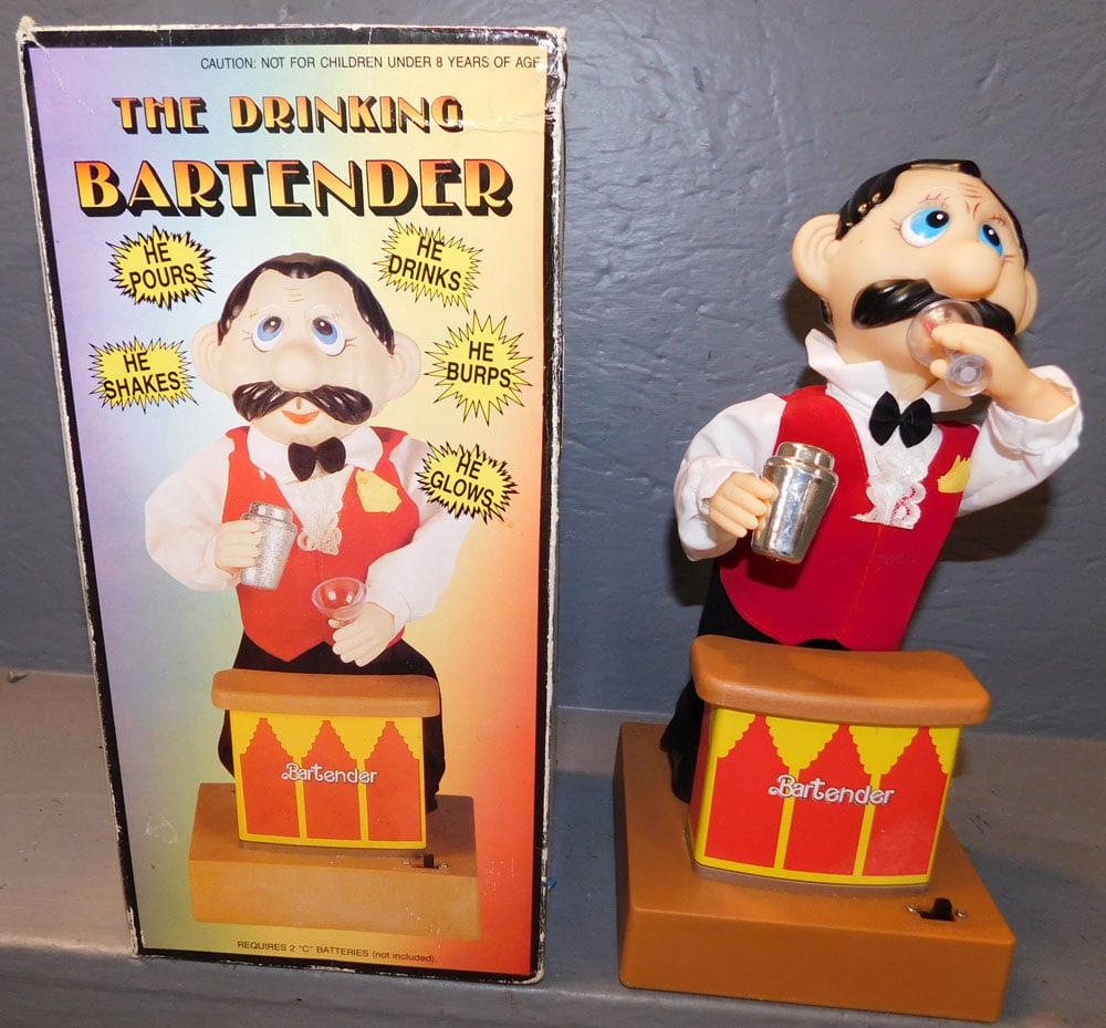The Drinking Bartender In Box: The Drinking Bartender In Box. Box: 13 3/4" x 13 3/4" ALL DESCRIPTIONS AND ANY CONDITION STATEMENT GIVEN BY LANGSTON AUCTION GALLERY ARE STRICTLY OPINIONS AND LANGSTON'S SHALL HAVE NO RESPONSIBILITY F