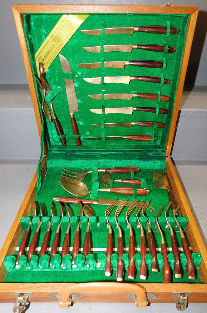 Brass & Rosewood Handle Flatware In Case: Brass & Rosewood Handle Flatware In Case. Case: 13" x 13" ALL DESCRIPTIONS AND ANY CONDITION STATEMENT GIVEN BY LANGSTON AUCTION GALLERY ARE STRICTLY OPINIONS AND LANGSTON'S SHALL HAVE NO RESPONSIBILI