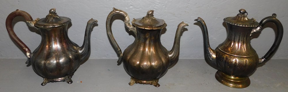 Three Silver Plated Tea Pots: Three Silver Plated Tea Pots. Up to 9 1/4" H ALL DESCRIPTIONS AND ANY CONDITION STATEMENT GIVEN BY LANGSTON AUCTION GALLERY ARE STRICTLY OPINIONS AND LANGSTON'S SHALL HAVE NO RESPONSIBILITY FOR ERRORS