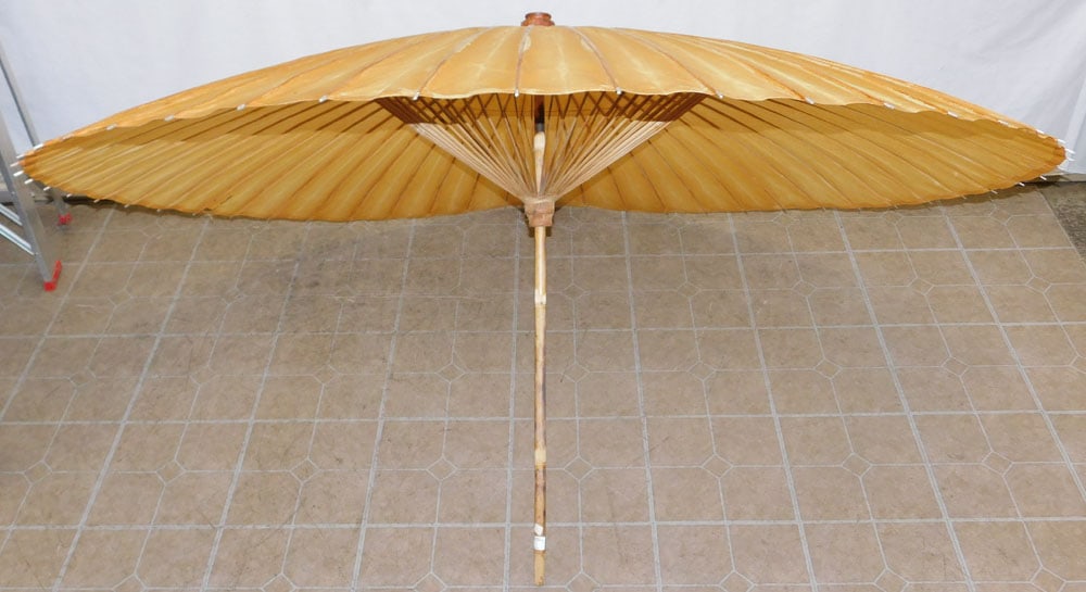 Oriental Bamboo & Rice Paper Umbrella: Oriental Bamboo & Rice Paper Umbrella. 44 1/2" L ALL DESCRIPTIONS AND ANY CONDITION STATEMENT GIVEN BY LANGSTON AUCTION GALLERY ARE STRICTLY OPINIONS AND LANGSTON'S SHALL HAVE NO RESPONSIBILITY FOR ER