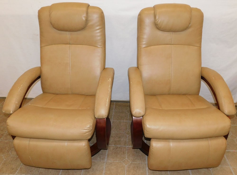 Pair Vinyl Swivel Upholstered Recliners: Pair Vinyl Swivel Upholstered Recliners. 40" H ALL DESCRIPTIONS AND ANY CONDITION STATEMENT GIVEN BY LANGSTON AUCTION GALLERY ARE STRICTLY OPINIONS AND LANGSTON'S SHALL HAVE NO RESPONSIBILITY FOR ERRO