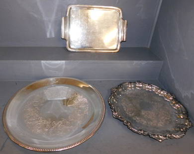 Three Silver Plate Serving Trays: Three Silver Plate Serving Trays. Up to 20" Dia. ALL DESCRIPTIONS AND ANY CONDITION STATEMENT GIVEN BY LANGSTON AUCTION GALLERY ARE STRICTLY OPINIONS AND LANGSTON'S SHALL HAVE NO RESPONSIBILITY FOR ER