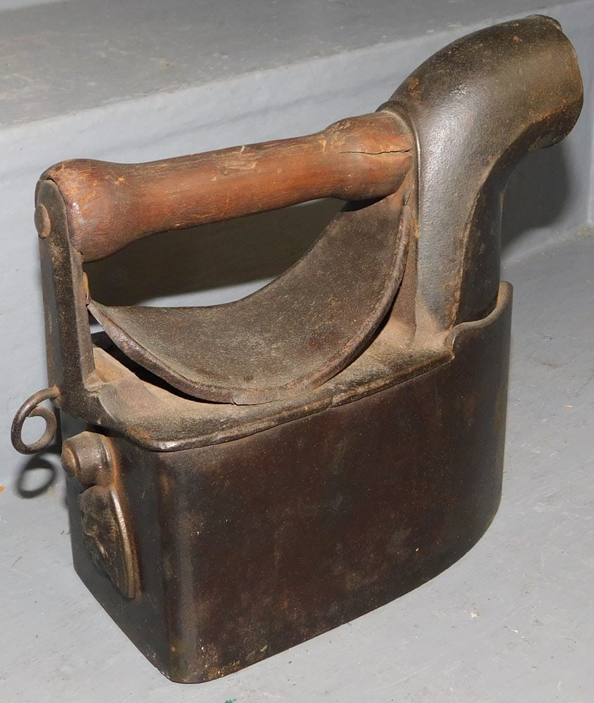 Cast Iron Coal Iron: Cast Iron Coal Iron. 7 3/4" H ALL DESCRIPTIONS AND ANY CONDITION STATEMENT GIVEN BY LANGSTON AUCTION GALLERY ARE STRICTLY OPINIONS AND LANGSTON'S SHALL HAVE NO RESPONSIBILITY FOR ERRORS OR OMISSIONS.