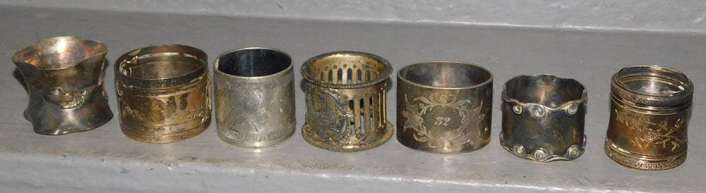 Lot Of Seven Vintage Silver Plate Napkin Rings: Lot Of Seven Vintage Silver Plate Napkin Rings. ALL DESCRIPTIONS AND ANY CONDITION STATEMENT GIVEN BY LANGSTON AUCTION GALLERY ARE STRICTLY OPINIONS AND LANGSTON'S SHALL HAVE NO RESPONSIBILITY FOR ERR