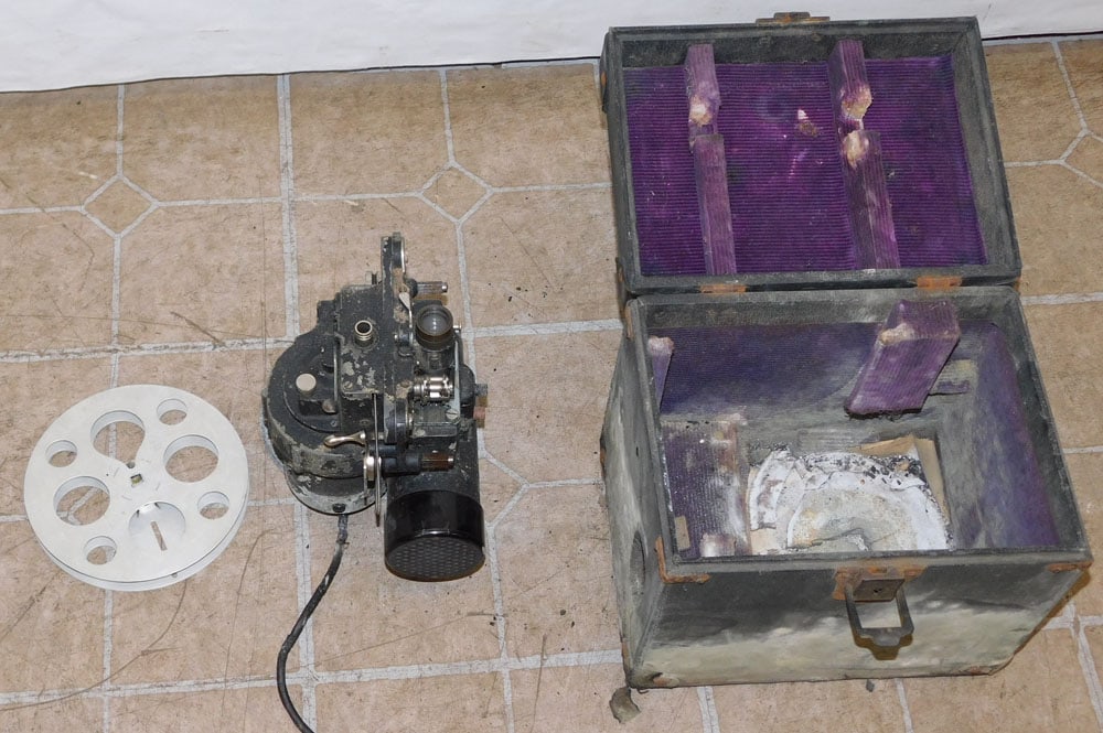 Antique Movie Projector In Case: Antique Movie Projector In Case. 11 1/2" W 9" D 11 1/2" H ALL DESCRIPTIONS AND ANY CONDITION STATEMENT GIVEN BY LANGSTON AUCTION GALLERY ARE STRICTLY OPINIONS AND LANGSTON'S SHALL HAVE NO RESPONSIBILI