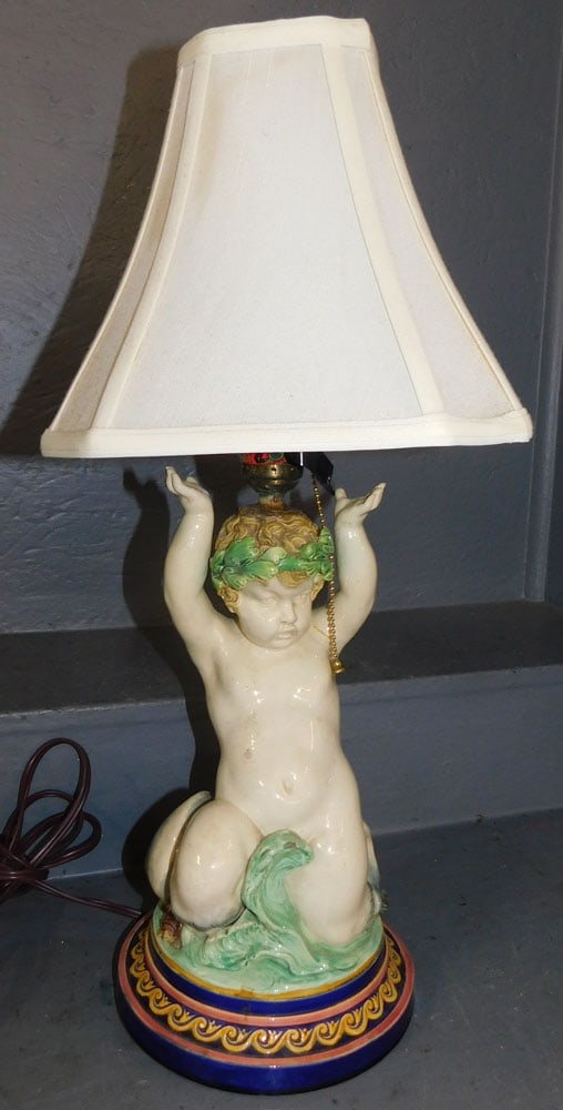 Majolica Putti Lamp, (Restored): Majolica Putti Lamp, (Restored). 23 1/2" H ALL DESCRIPTIONS AND ANY CONDITION STATEMENT GIVEN BY LANGSTON AUCTION GALLERY ARE STRICTLY OPINIONS AND LANGSTON'S SHALL HAVE NO RESPONSIBILITY FOR ERRORS O