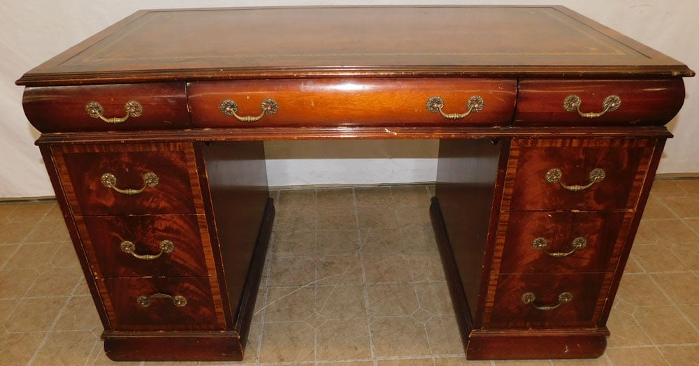 Mahogany & Tooled Leather Top Desk: Mahogany & Tooled Leather Top Desk . 20 1/4" W 26 1/4" D 30 1/2" H ALL DESCRIPTIONS AND ANY CONDITION STATEMENT GIVEN BY LANGSTON AUCTION GALLERY ARE STRICTLY OPINIONS AND LANGSTON'S SHALL HAVE NO RES