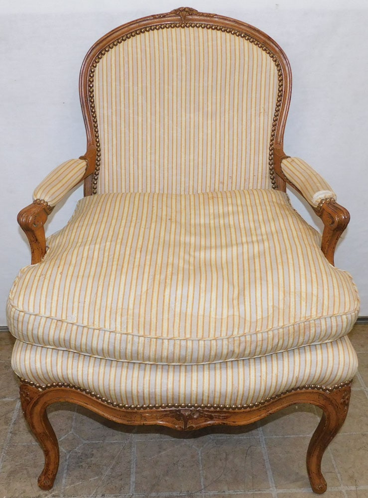Carved Walnut French Arm Chair: Carved Walnut French Arm Chair. 36" H ALL DESCRIPTIONS AND ANY CONDITION STATEMENT GIVEN BY LANGSTON AUCTION GALLERY ARE STRICTLY OPINIONS AND LANGSTON'S SHALL HAVE NO RESPONSIBILITY FOR ERRORS OR OMI