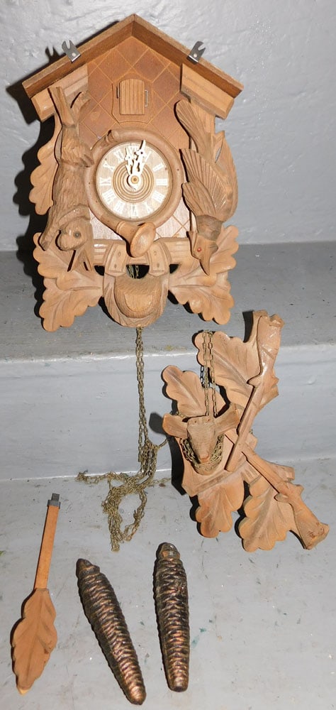 Cuckoo Clock: Cuckoo Clock. 12" H ALL DESCRIPTIONS AND ANY CONDITION STATEMENT GIVEN BY LANGSTON AUCTION GALLERY ARE STRICTLY OPINIONS AND LANGSTON'S SHALL HAVE NO RESPONSIBILITY FOR ERRORS OR OMISSIONS. THE ABSENC