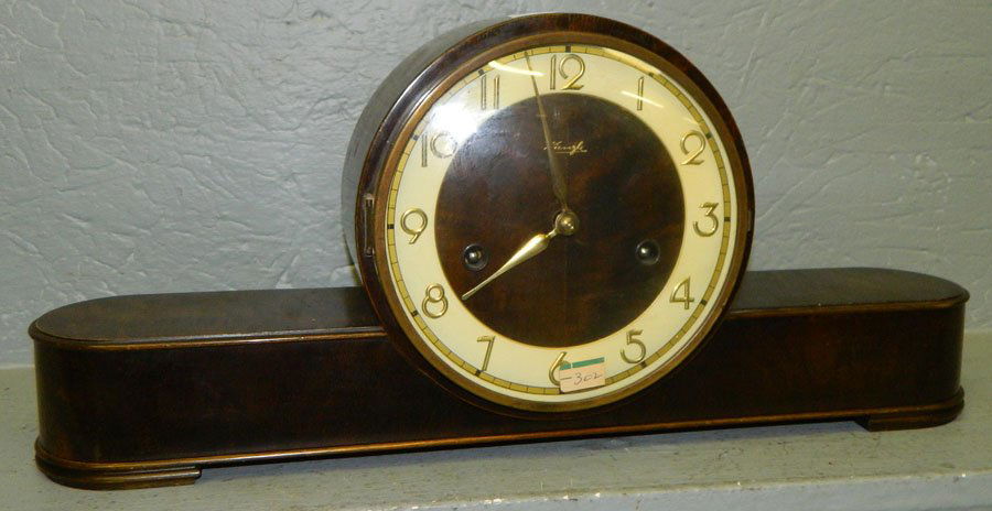 8 day German Kienzle modern case clock.: Eight day German Kienzle modern case clock. 19 " x 8 ".