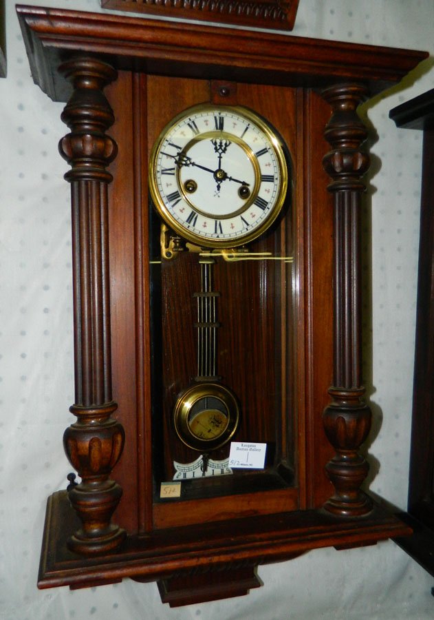 Mahogany case 8 day wall clock w/porcelain dial: Germanic type mahogany case eight day wall clock with R-A pendulum and porcelain dial. Top is not attached. Case is 15" x 22".