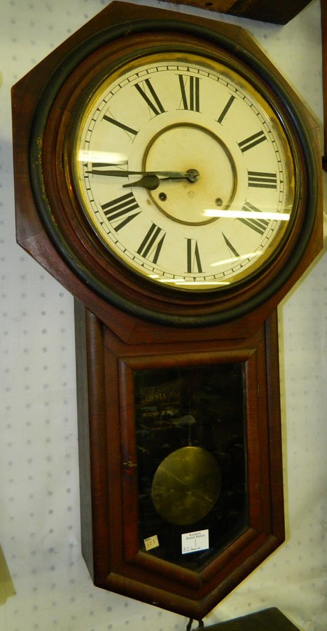 Ansonia 8 day schoolhouse wall clock.17" x 31".: Ansonia eight day schoolhouse wall clock with heavy brass pendulum. 17" x 31".